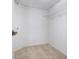 Spacious walk-in closet with neutral carpet and shelf for storage at 7104 L Pavia Blvd # 7104, Venice, FL 34292