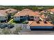 Beautiful condo with red tile roof, lush landscaping, and convenient parking at 7104 L Pavia Blvd # 7104, Venice, FL 34292