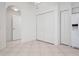 Bright laundry area featuring tiled flooring, a ceiling fan, and a utility closet with a washer and dryer at 7104 L Pavia Blvd # 7104, Venice, FL 34292