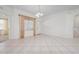 Bright living room with tile flooring, neutral decor and a window at 7104 L Pavia Blvd # 7104, Venice, FL 34292