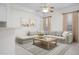 Comfortable living room featuring a sectional sofa, modern decor, and a ceiling fan for added comfort at 7104 L Pavia Blvd # 7104, Venice, FL 34292