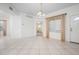 Bright living room with tile flooring, neutral decor and a window at 7104 L Pavia Blvd # 7104, Venice, FL 34292