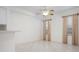 Bright living space featuring neutral walls, tile floors, and large windows with neutral curtains at 7104 L Pavia Blvd # 7104, Venice, FL 34292
