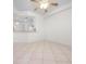 Open floor plan features neutral tile flooring, abundant natural light and ceiling fan at 7104 L Pavia Blvd # 7104, Venice, FL 34292