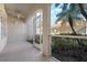 An enclosed porch provides views of the beautiful manicured landscaping at 7104 L Pavia Blvd # 7104, Venice, FL 34292
