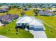 A sprawling single Gathering house in a residential neighborhood with a well-manicured lawn and modern finishes at 7407 S Blue Sage, Punta Gorda, FL 33955