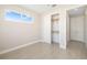 Bright bedroom with large window and walk-in closet with shelving at 7407 S Blue Sage, Punta Gorda, FL 33955