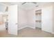 Bright bedroom with neutral paint, tile floors, ceiling fan, and a closet with sliding doors at 7407 S Blue Sage, Punta Gorda, FL 33955