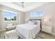Bright bedroom with large windows, neutral decor, and stylish furniture at 7407 S Blue Sage, Punta Gorda, FL 33955