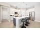 Modern, bright kitchen with white cabinets, stainless steel appliances, a center island and pendant lighting at 7407 S Blue Sage, Punta Gorda, FL 33955