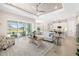 Open-concept living room with a view of the kitchen, pool, and sliding glass doors at 7407 S Blue Sage, Punta Gorda, FL 33955