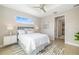 Brightly lit main bedroom featuring an open doorway and modern decor at 7407 S Blue Sage, Punta Gorda, FL 33955