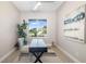 Bright, windowed home office with desk, chair, and area rug at 7407 S Blue Sage, Punta Gorda, FL 33955