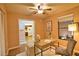 Charming bedroom with ceiling fan, large window, stylish work area, and view to living area at 7941 Pineglen Ct # 37, Sarasota, FL 34238