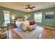 Comfortable bedroom featuring natural lighting, a ceiling fan, and stylish furnishings at 7941 Pineglen Ct # 37, Sarasota, FL 34238