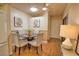 Cozy dining area featuring a round table with four chairs and contemporary decor at 7941 Pineglen Ct # 37, Sarasota, FL 34238
