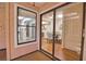 Bright dining room with views of the kitchen and the sunroom coming through the large sliding glass door at 7941 Pineglen Ct # 37, Sarasota, FL 34238