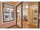 Bright dining room with wood floors, a round table and views to the kitchen, laundry and sunroom at 7941 Pineglen Ct # 37, Sarasota, FL 34238