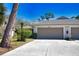 Charming home featuring a two-car garage, well-manicured landscaping, and a welcoming entrance at 7941 Pineglen Ct # 37, Sarasota, FL 34238