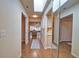 Hallway has wood floors and a large mirror, and access to the living room, dining room, and a linen closet at 7941 Pineglen Ct # 37, Sarasota, FL 34238