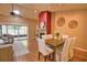 Comfortable living area featuring a stone fireplace, vaulted ceiling, and seamless access to a patio at 7941 Pineglen Ct # 37, Sarasota, FL 34238