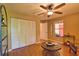 Comfortable living room is a place to unwind, with wood floors, furniture, and natural light at 7941 Pineglen Ct # 37, Sarasota, FL 34238