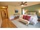 Comfortable main bedroom with ensuite bathroom access and bench at 7941 Pineglen Ct # 37, Sarasota, FL 34238