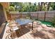 Enchanting backyard patio with dining set and garden, perfect for outdoor gatherings at 7941 Pineglen Ct # 37, Sarasota, FL 34238
