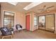 Bright sunroom with skylights and seating, connects to other rooms through doors and large sliding glass doors at 7941 Pineglen Ct # 37, Sarasota, FL 34238