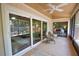Spacious sunroom with ceiling fan and access to back yard at 7941 Pineglen Ct # 37, Sarasota, FL 34238