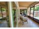 Inviting sunroom with tile floor and outdoor view through sliding glass doors at 7941 Pineglen Ct # 37, Sarasota, FL 34238