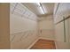 Spacious walk-in closet featuring shelving and plenty of storage space at 7941 Pineglen Ct # 37, Sarasota, FL 34238