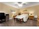 Cozy bedroom with wood floors, ceiling fan, furnishings, and a bright, airy feel at 867 Country Club Cir #71, Venice, FL 34293