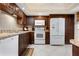 Well-equipped kitchen with white appliances and granite countertops at 867 Country Club Cir #71, Venice, FL 34293