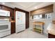 Bright kitchen with ample cabinet space, modern appliances, and a window view at 867 Country Club Cir #71, Venice, FL 34293