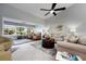 Inviting living room with neutral decor, comfortable seating, tile floors, and a golf course view at 867 Country Club Cir #71, Venice, FL 34293