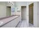 Tidy bathroom featuring double sinks, and a separate shower room at 904 Harbor Town Dr, Venice, FL 34292