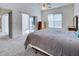 Spacious bedroom with sliding glass doors to a patio and a ceiling fan at 904 Harbor Town Dr, Venice, FL 34292