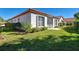 Charming single-story home with a red tile roof and manicured landscaping at 904 Harbor Town Dr, Venice, FL 34292