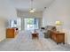 Cozy living room with a ceiling fan, comfortable seating, and access to outdoor views at 904 Harbor Town Dr, Venice, FL 34292