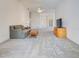 Spacious living room with neutral carpet, ceiling fan, and natural light from the entry at 904 Harbor Town Dr, Venice, FL 34292