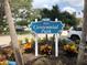 Centennial Park sign surrounded by colorful foliage at 904 Harbor Town Dr, Venice, FL 34292