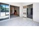 Covered patio area boasts tiled flooring and sliding glass doors to the interior at 904 Harbor Town Dr, Venice, FL 34292
