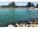 Scenic waterway view with a boat passing by at 904 Harbor Town Dr, Venice, FL 34292