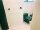 A well-lit bathroom features a bright green toilet and matching marble details at 919 Key Way, Nokomis, FL 34275