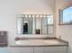 Well-lit bathroom with a double sink vanity, offering ample counter space and storage for convenience at 919 Key Way, Nokomis, FL 34275