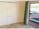 Bedroom with closet and view to the pool and intercoastal waterway at 919 Key Way, Nokomis, FL 34275