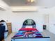 A clean bright bedroom has a closet and space-themed decor at 919 Key Way, Nokomis, FL 34275