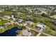 Aerial view of neighborhood, showing homes interspersed with canals and green spaces at 951 Sea Fox Rd, Venice, FL 34293