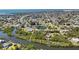 Expansive aerial view of a waterfront community with lush greenery and stunning canal access at 951 Sea Fox Rd, Venice, FL 34293
